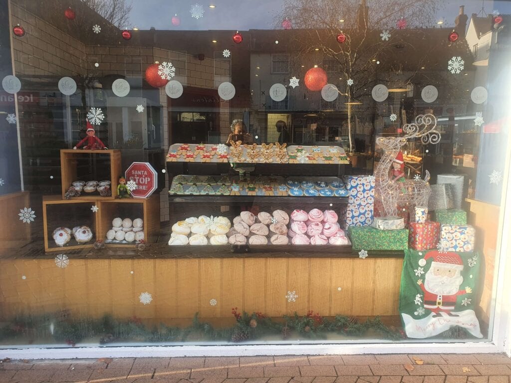 festive shop window display of The Little Blue Bakery